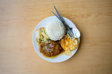 pork steak and fried egg with rice 