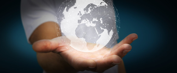 Businessman using digital tactile world interface with his finge