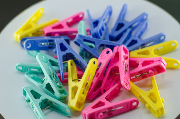 Lots of clothespins on a white background