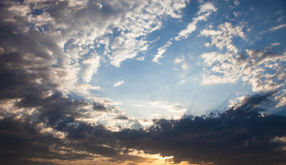 Cloudscape with the sun rays radiating from behind the cloud