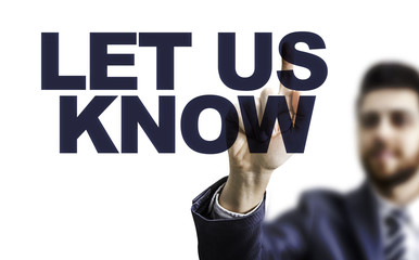 Business man pointing the text: Let Us Know