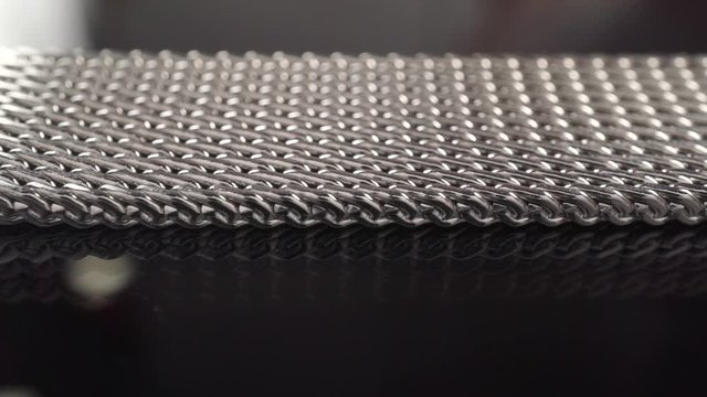 Shiny steel watch bracelet dolly shot, shallow focus