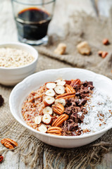 Chocolate Quinoa breakfast bowl decorated with hazelnuts, Pecan,