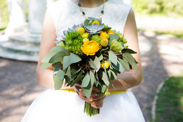 Bride with wedding bouquet, closeup