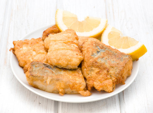 Pieces Of Fried Hake Dish With Lemon