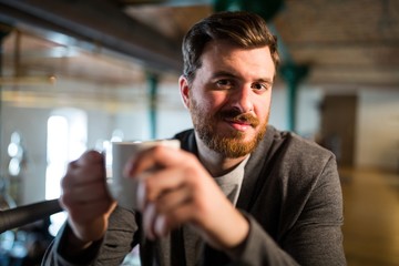 Man holding coffee cup