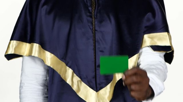 Graduate holds a green card. White. Close up