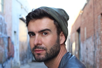 Hot man surrounded by graffiti walls 