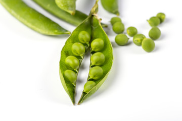 fresh green peas isolated on a white background..
