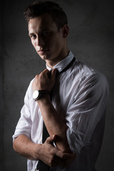 Fototapeta na wymiar young business man style, fashion the financial sector, piercing glance confident,