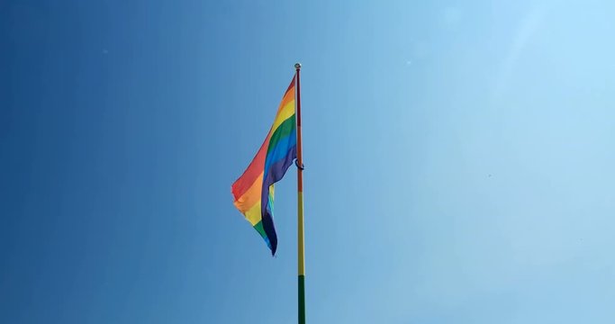 Medium shot of pride flag waving in the wind