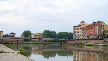 Pisa, Arno river. Early in the morning in Tuscany, Italy, Europe
