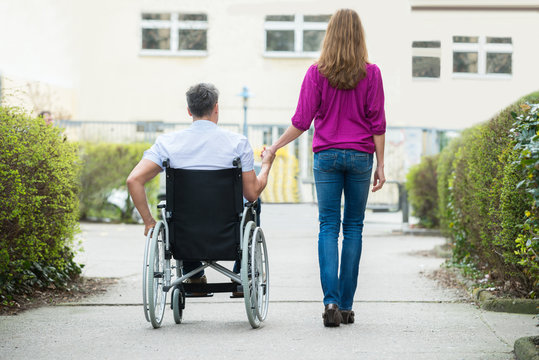 Woman With Her Disabled Husband