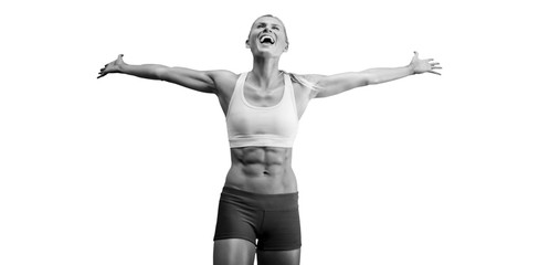 Fit woman celebrating victory with arms stretched