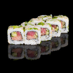 Sushi rolls with salmon, tuna, cucumber and green onions