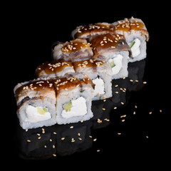 Sushi rolls with eel, cucumber and soft cheese
