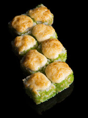 Grilled sushi rolls with caviar and cheese