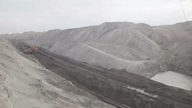 Open pit mining, development of trench excavator dragline.