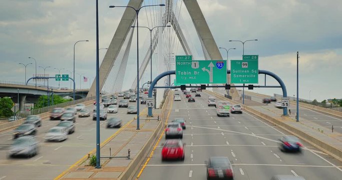 A time lapse view of traffic on the Leonard P. Zakim Bunker Hill Bridge over the Charles River in Boston.	 	