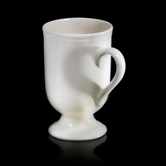 Isolated of ceramic mug on black background with heart shadow