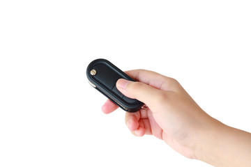 women hand presses on the remote control car key alarm systems