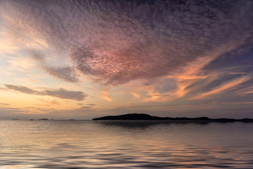 Beach sunset seascape photo in Thailand.