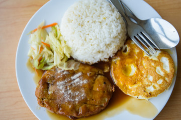 pork steak and fried egg with rice 
