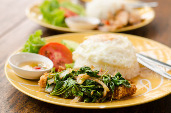 Thai food,spicy stir-fried crispy chicken with basil,fried egg and rice (Kapao kai Khai dao)