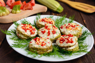 Spicy fried zucchini rings with mayonnaise, garlic, hot pepper and herbs. Close-up
