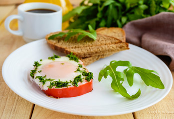 Scrambled eggs, baked in a ring bell pepper, toast, arugula leaves and a cup of coffee. Light breakfast.