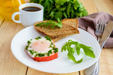Scrambled eggs, baked in a ring bell pepper, toast, arugula leaves and a cup of coffee. Light breakfast.