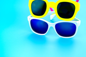 colorful sunglasses at light blue studio background,Summer Holid