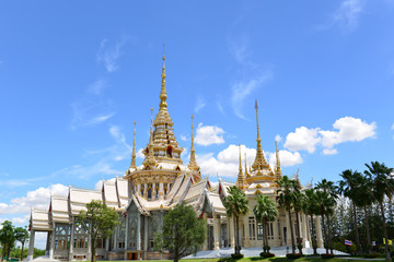 Beautiful Thai sculpture temple and and Blue sky with Clouds background.