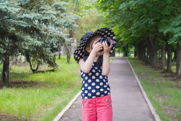 Happy childhood . beautiful childhood .  the advanced child . The girl in a hat from the sun. A hat...