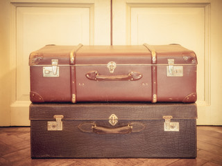 Vintage suitcase on the floor. Pastel color