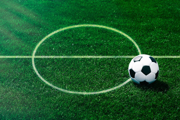 Fototapeta na wymiar Soccer football field stadium and ball on green grass