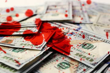 Many hundred dollars cash money with bloodstains