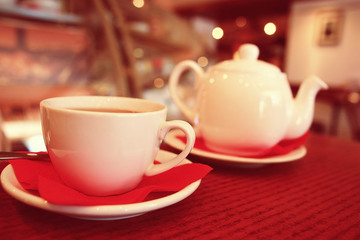 teapot and cup of tea at a cafe