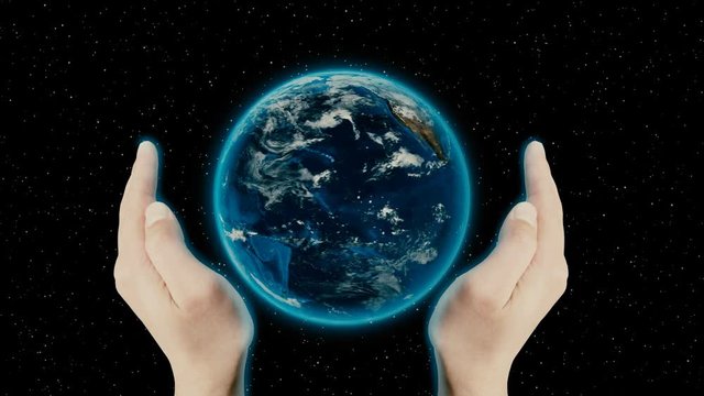 Hands around spinning earth in space. Looped animation