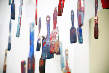 Art objects painty brushes hanging in the air