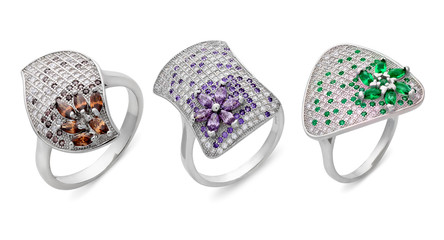 Close-up on three silver rings of different shapes