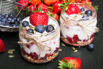 delicious dessert - yogurt with strawberries and blueberries