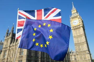 Fototapeta na wymiar European Union and British Union Jack flag flying in front of Big Ben and the Houses of Parliament at Westminster Palace, London, in preparation for the Brexit EU referendum