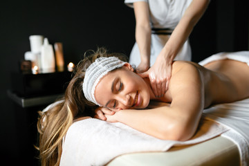 Obraz na płótnie Canvas Massage therapist massaging woman