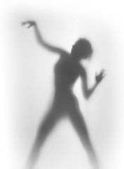 Silhouette of a beautiful and sexy dancing woman