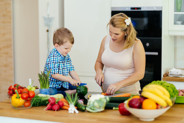 Mother and child preparing lunch