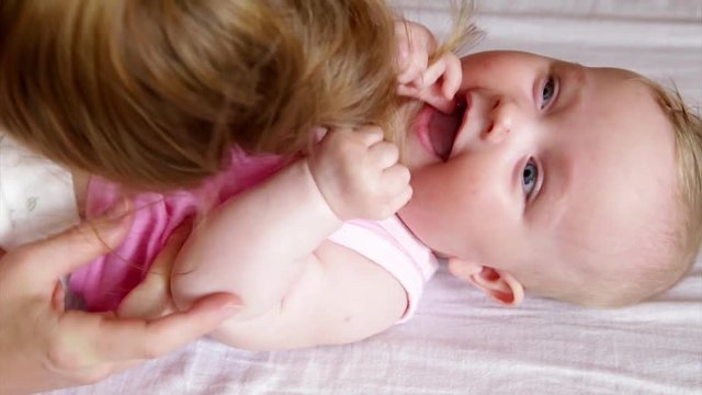 mommy tickling baby tummy laughing smiling grabbing hairs joy love 