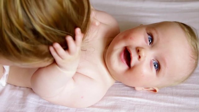 mommy tickling baby tummy laughing smiling grabbing hairs joy love 