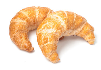 Fresh and tasty croissant over white background