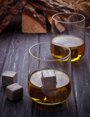 Glass of whiskey with stones